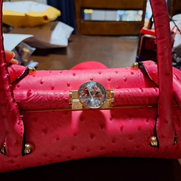 Ruby is a unique handbag that is made of faux leather.  She has a center jeweled - Picture 1 of 7
